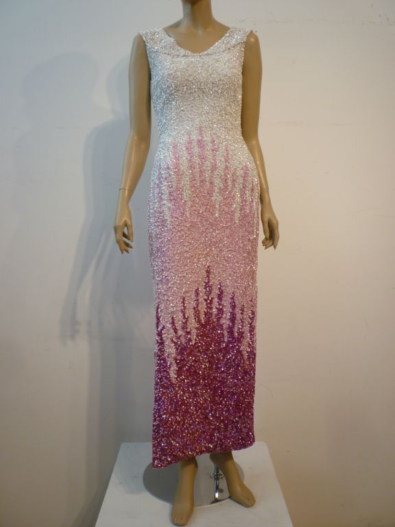 A fabulous Mr. Blackwell gown from the 50s or 60s in solid sequins with a tri-color (white pink and fuchsia) design.  A spectacular head-turner!
