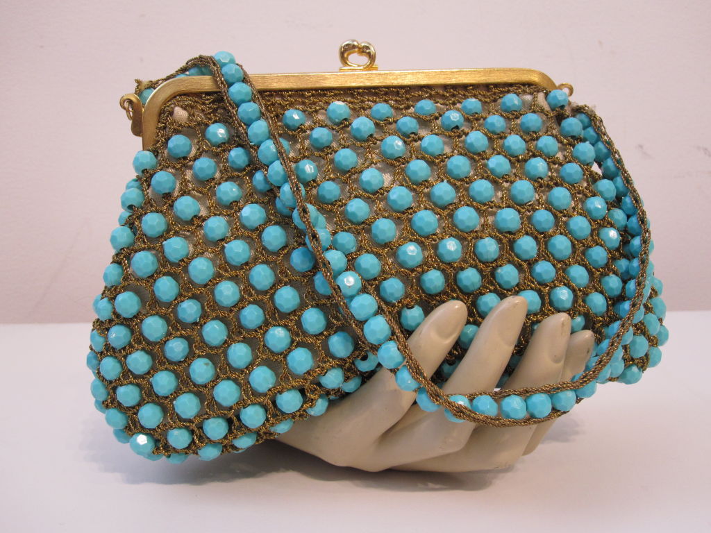 A charming 60s Rosenfeld evening bag made in Italy for Rosenfeld using gold thread and faceted turquoise colored beads.  Snap closure, beige satin lining. <br />
<br />
Measures: <br />
6