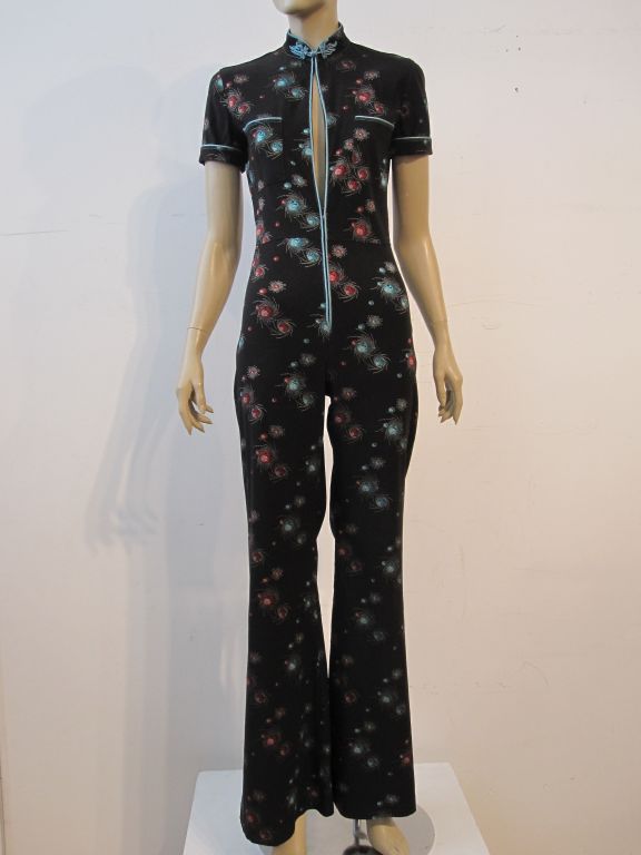 Jean Paul Gauthier Asian-inspired brocade jumpsuit with front zipper, spectacular star burst design brocade and turquoise silk piping and frog closures.  Marked a French size 38, US 8.