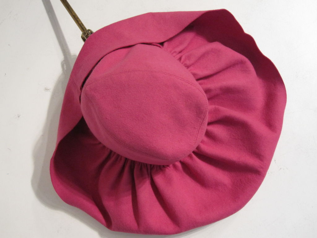 A wonderful large, soft pleated brim hat in vibrant pink from Carson, Pirie and Scott. Lined in black silk tulle. Marked size 22.