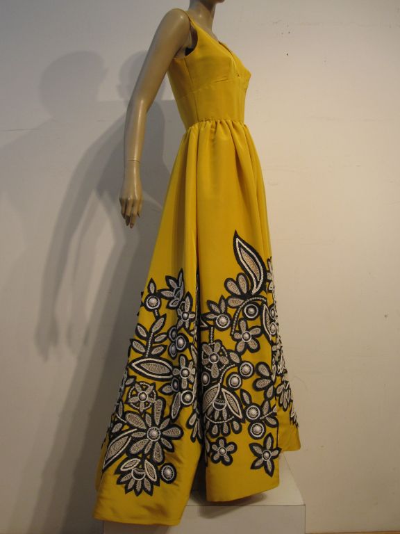 Oscar De la Renta incredible yellow silk faille ball gown with hand embroidered black and white stylized floral applique work. Marked a US size 8.