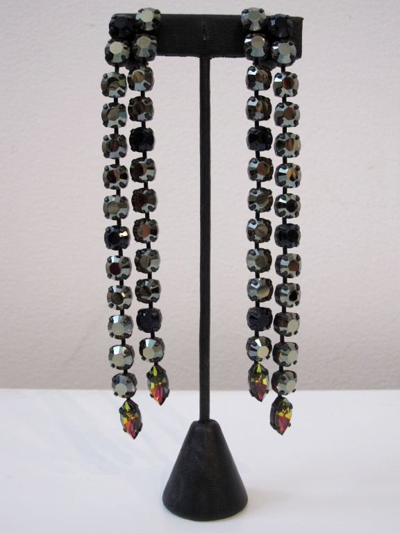 These incredible 6-inch long shoulder duster dangle earrings are made by JL Blin from vintage Czech crystals and other findings.  These feature large hematite gray, indigo blue/purple and aurora borealis stones in a simple double chain drop. 