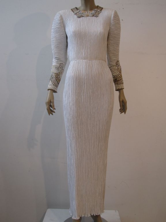 A gorgeous Mary McFadden grecian style Fortuny-esque pleated gown with incredibly detailed and beautiful beaded and sequined neck and sleeve details.  Marked size 6.