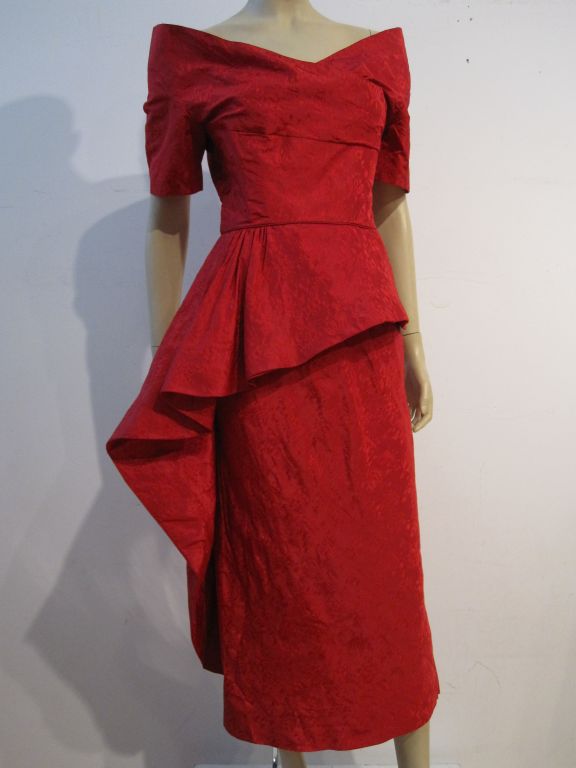 Ceil Chapman 1950s spectacular red jacquard holiday dress with stand-up portrait neckline and asymmetrical side draped peplum.  Incredibly beautiful and well constructed.  Size 8
