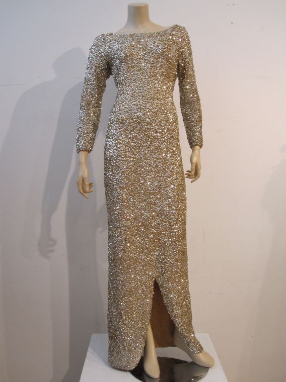 1950s spectacular gold sequin gown, hand-sewn sequins on wool knit to conform to every curve.  Super-sexy with a deep cut back and curved front slit.  Metal back zipper. Made by Gene Shelley's International Boutique.