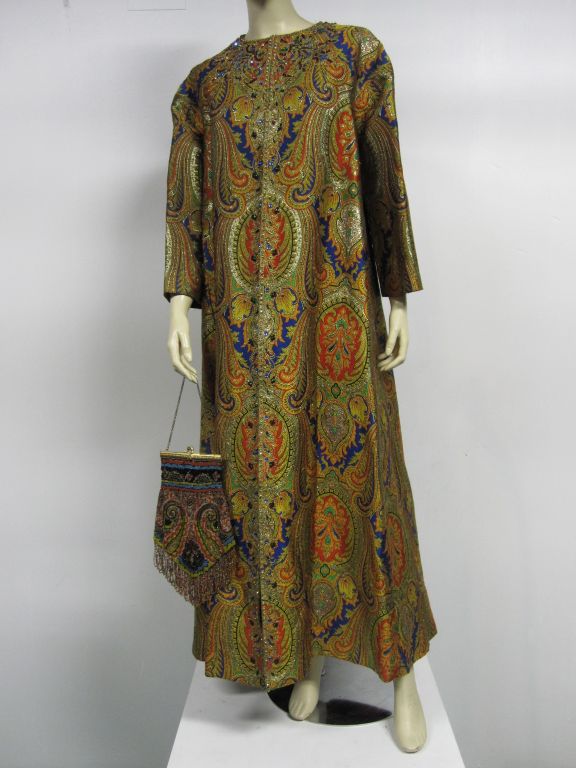 A wonderful Nina Ricci Couture piece from the early 70s; a paisley pattern, rhinestone embellished full length evening coat with a matching (Not Nina Ricci, but a vintage 20s) elaborately  beaded handbag.