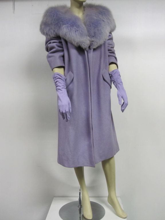 Absolutely beautiful 50s wool/cashmere jacket with matching violet dyed huge fox fur collar.  Clutch style with no closures and front pockets. Bracelet length sleeves. No label present in the satin lining, but obviously great quality!  Size M.