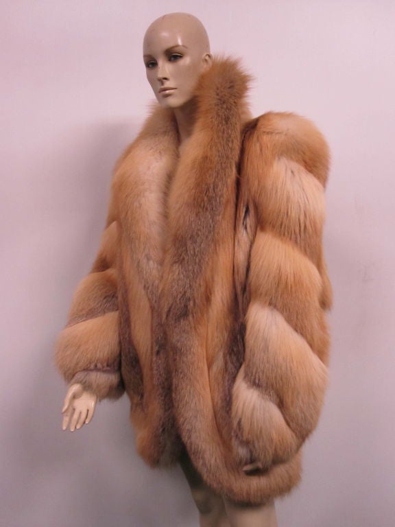 A wonderfully dramatic 1970s Aladino Stefani red fox fur knee-length coat with fabulous styling in the extreme style of the 1940s.  Satin lining. Gorgeous.  Size 8-10