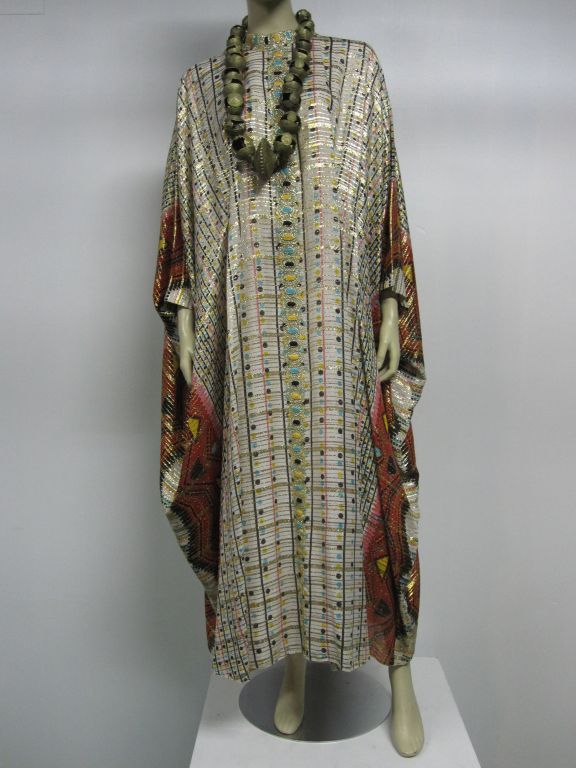 A wonderful silk lamé Saks Fifth Avenue Indian-inspired graphic caftan from the late 60s with adjustable fitting under the bust for shape.  Size US 6-8 Petite