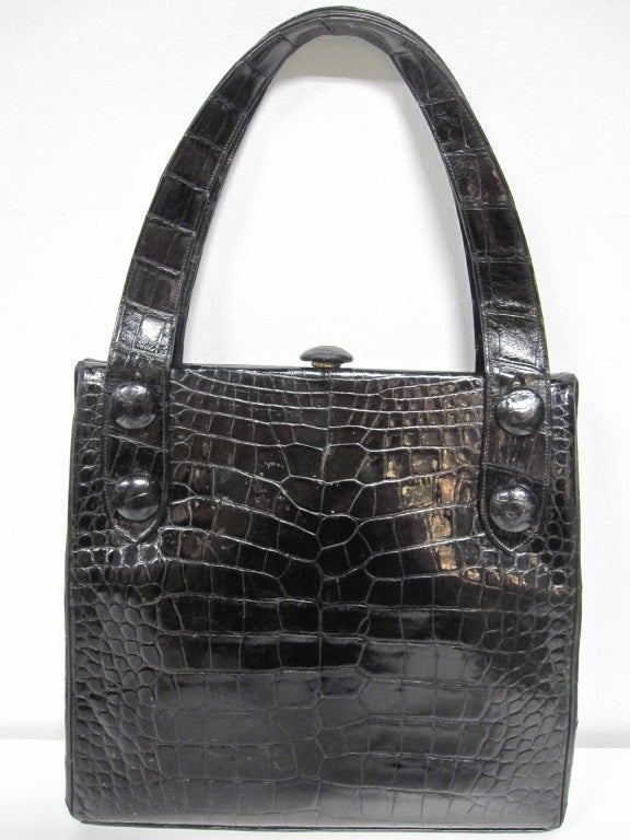 A fantastic 50s Koret black alligator handbag (center skin) with gorgeous red leather lining.  Genuine Alligator.  Wonderful 