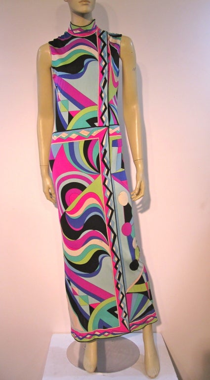 A spectacular 60s Emilio Pucci long maxi dress in spectacular print design and shades of purple, fuchsia, black green blue and white. Pure silk jersey originally sold at Saks Fifth Avenue and marked a vintage size 10 which is about a modern 6. In