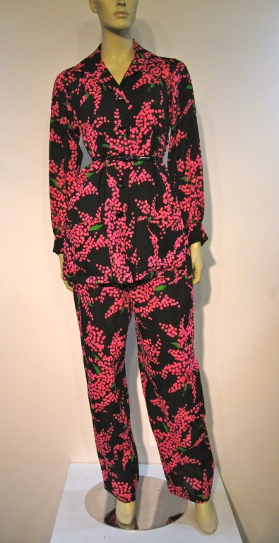 The famous pantsuit that Yves Saint Laurent made famous in lightweight wool--black background, pink and green 