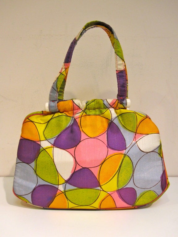 A wonderful little mod Ingber 60s purse in multi-colored silk and white plastic. Pink piping in seams. Fabric lined....the perfect cheery summer purse! <br />
<br />
Measures 10