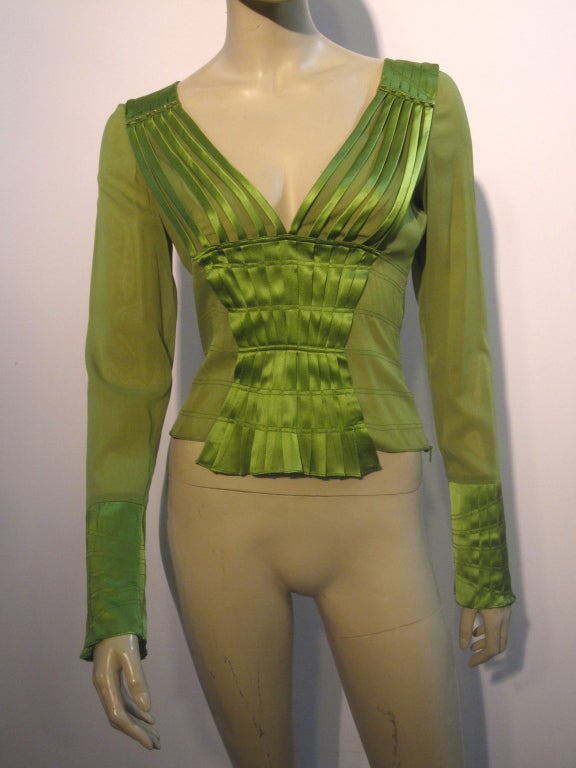 A fabulous sexy Gucci blouse of silk chiffon and satin, in a pleated piped deep V neck and long slim sleeves.  Made with a bit of elastin incorporated in the fabric for shape.  Marked Italian size 40.