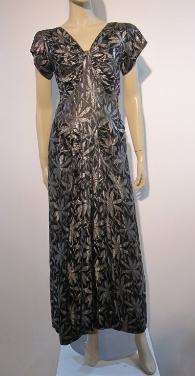 An exquisite late 30s gown, unlabeled, in silver/black lamé brocade in a bamboo leaf pattern.  