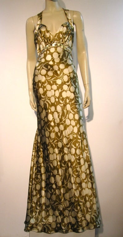 A gorgeous 30s inspired Vera Wang silk satin racer-back gown in silk satin stylized floral print.  Empire waist is trimmed in sequin band.  Ties in back at waist.  New with tags, never worn.  Size 8 US/46 French.