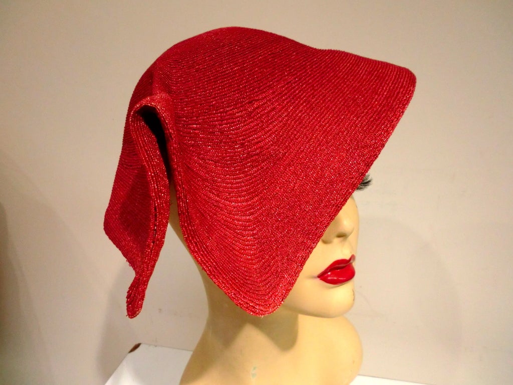 FANTASTIC Dior construction skull cap, tightly woven straw in the unique Dior Red.