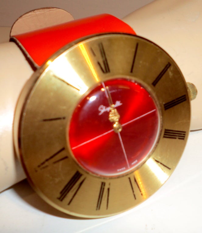 Patent leather, brass with Swiss movement.