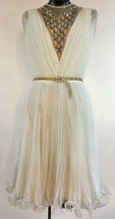 A fabulous 60s crystal pleated mini with deep V jeweled illusion neck. Size 6.