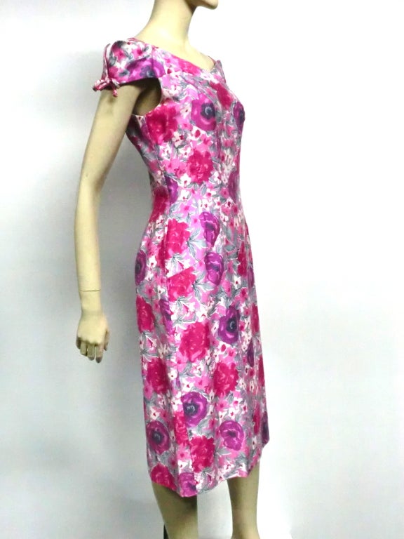 A fantastic little 50s floral print cotton summer sheath with beautiful off-the-shoulder details.  Size 6-8.