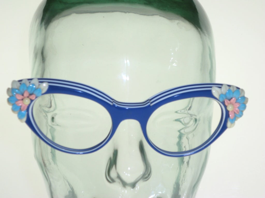 Amazing over-the-top Schiaparelli 1950s cat-eye sunglass/eyeglass frames with laminated stripes and elaborate celluloid temple decorations!  Never used before and ready to have lenses put in!  fantastic blue and white stripe laminated frames and