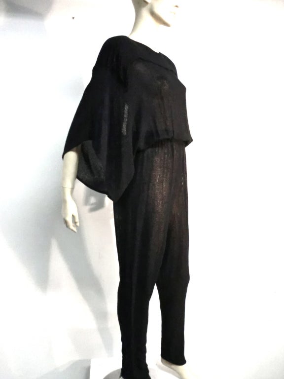 Gauzy Rayon Jumpsuit with Draped Sleeve and Fringe