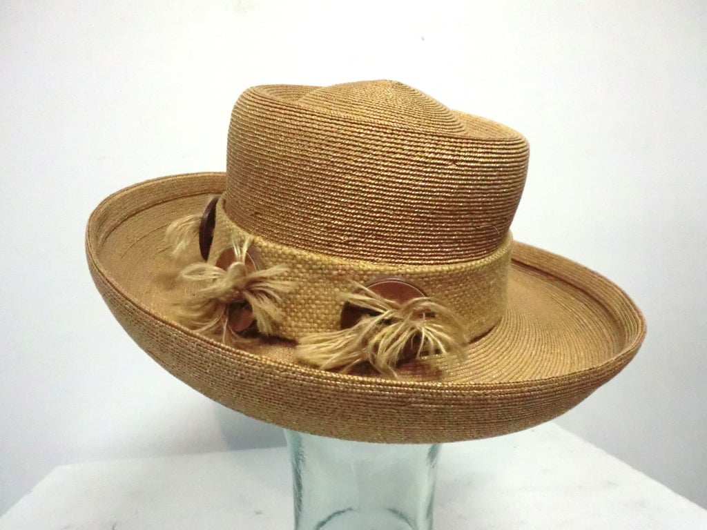 A fantastic Otto Lucas Junior Straw hat, made in Italy, with burlap and wood trims.  Originally from Marshall Field and Company.