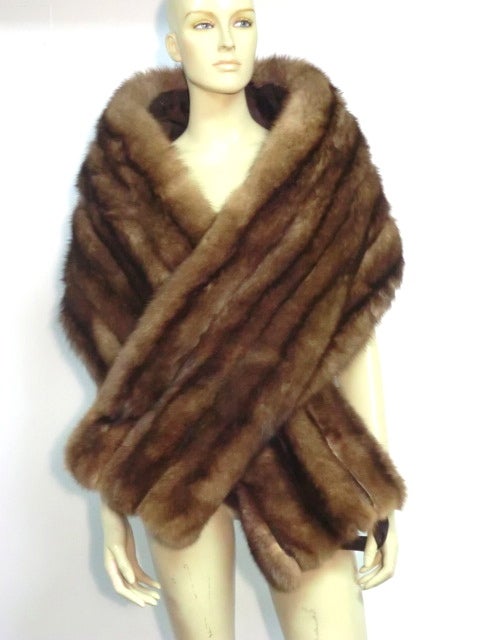 A gorgeous Russian sable wrap from the 50s: a long rectangular shape backed in satin and four pelts wide!  Has fabric straps for security.  Gorgeous!