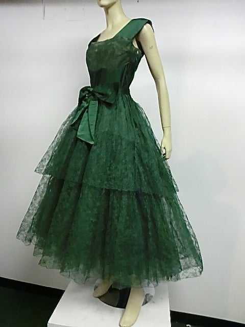 A fantastic 50s silk Chantilly lace and satin tea length gown in Kelly green by Rosalie MacRini, originally sold at Ransohoff's department store (which is the store that Jimmy Stewart took Kim Novak to in San Francisco, shopping for the famous gray