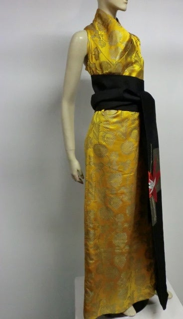 An incredible 1920s silk jacquard 1920s ceremonial gown from Mongolia with floral and pineapple pattern and contrasting floral lining. Sold with Japanese obi.