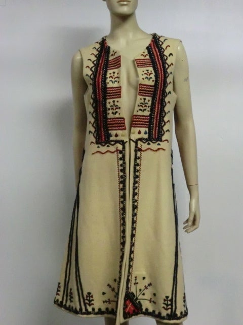 Dated 1973, this hand-crafted Romanian traditional heavy wool, lined sleeveless coat/vest is as beautiful as it is hardy.  Approx. size Large (10)