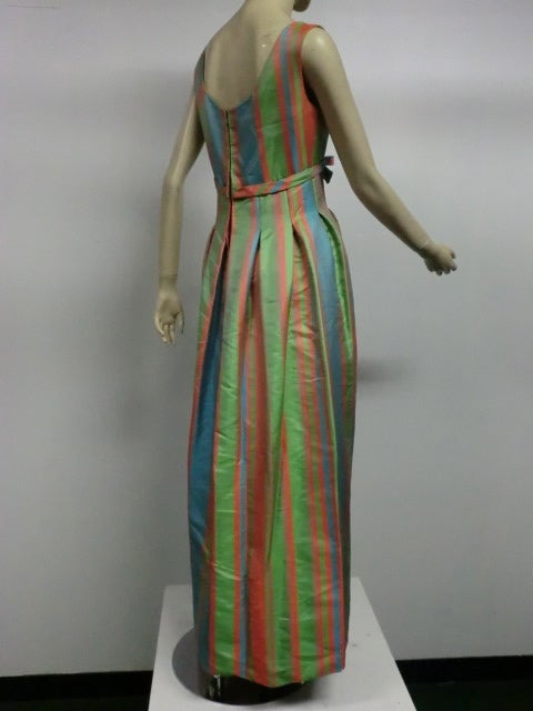A wonderful 50s Marshall Field and Co.Catherine Scott silk gown in vivid striped silk faille.  Bodice is structured and skirt is heavily pleated at hip.  Never worn with original tags!  Size 6.