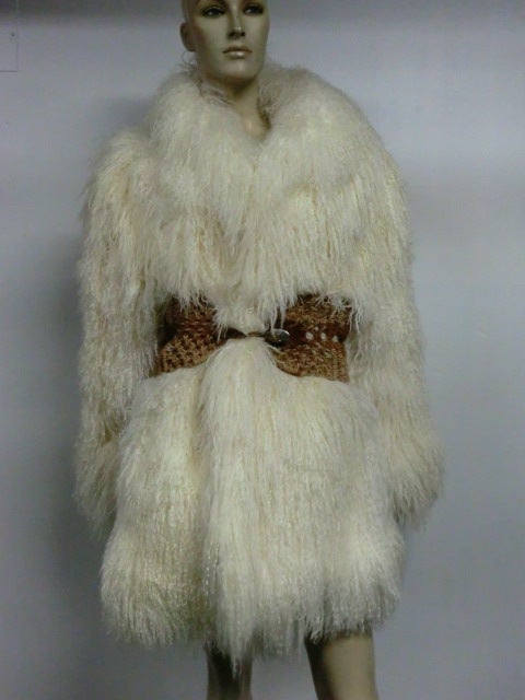 A great winter white 70s/80s Mongolian lamb chubby coat, fully lined and sized to fit  up to size 10. Pictured with macrame and snakeskin belt, available separately.