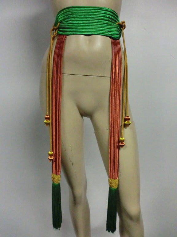 A gorgeous Yves Saint Laurent braid and tassel belt in kelly green yellow and coral.  Small to medium size. Absolutely stunning.