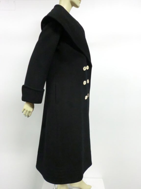 Geoffrey Beene 80s black double breasted wool coat with portrait collar and rhinestone buttons.  Cuffed sleeves.  Size 8 approx.  Originally sold at Saks Fifth Ave.