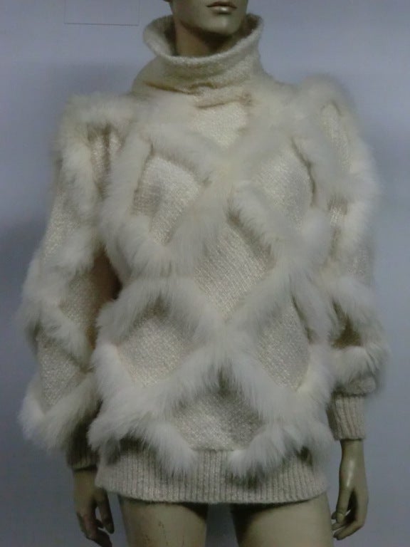 A fabulous 80s bias cut, dolmam sleeved cream wool tweed and fox fur latice work pull over.  Size M from Signatures.