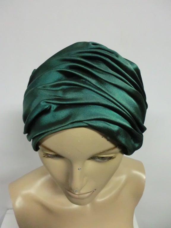 A gorgeous 60s Christian Dior emerald green satin turban.  Lined. Size M to Large.