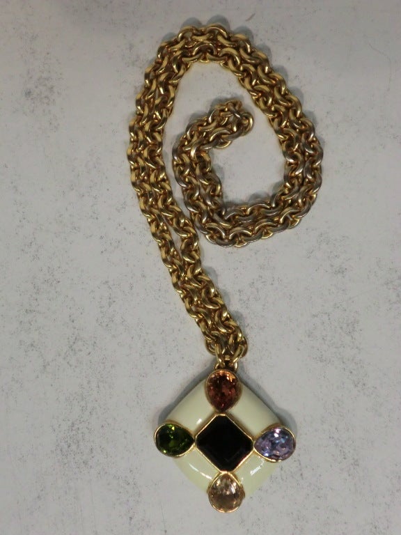 A great Ciner 70s pendant:  enamel and rhinestone w/ gold0-tone metal chain and base.  Chain is 31