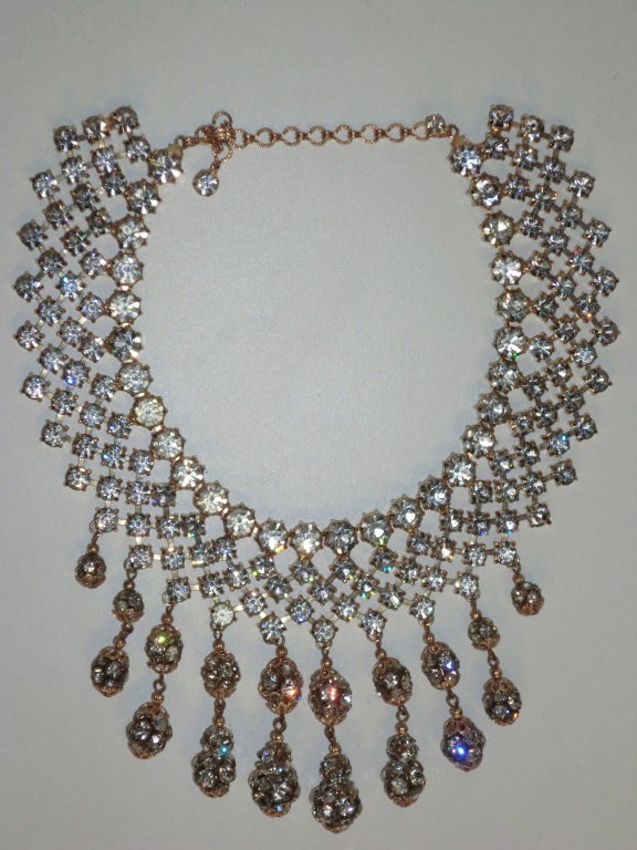 A beautiful glittery 1960s bright rhinestone bib necklace with drop rondelle beads.