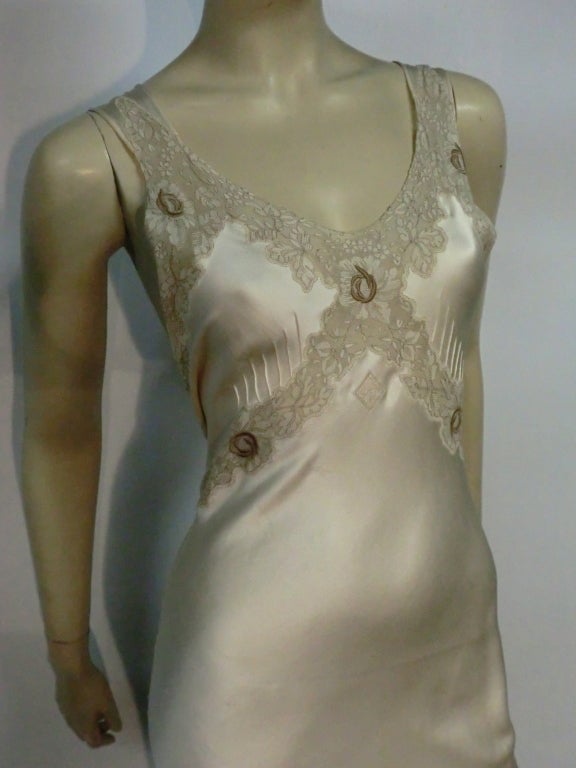 A gorgeous 30s bias-cut silk satin nightgown with pintucking, lace applique and embroidered details.  Back tie sash and small monogram (BMS) under bust.
