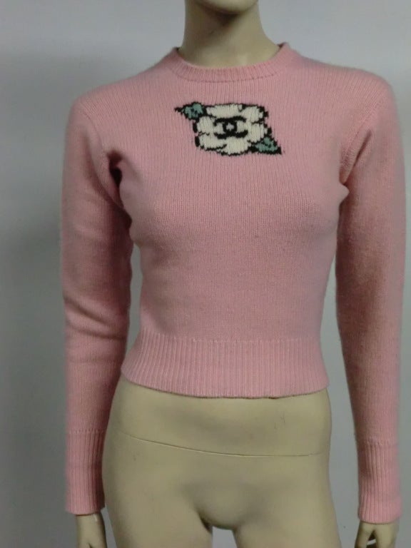 An adorable Chanel 4ply cashmere sweater with knit camellia logo.  Size 4 US