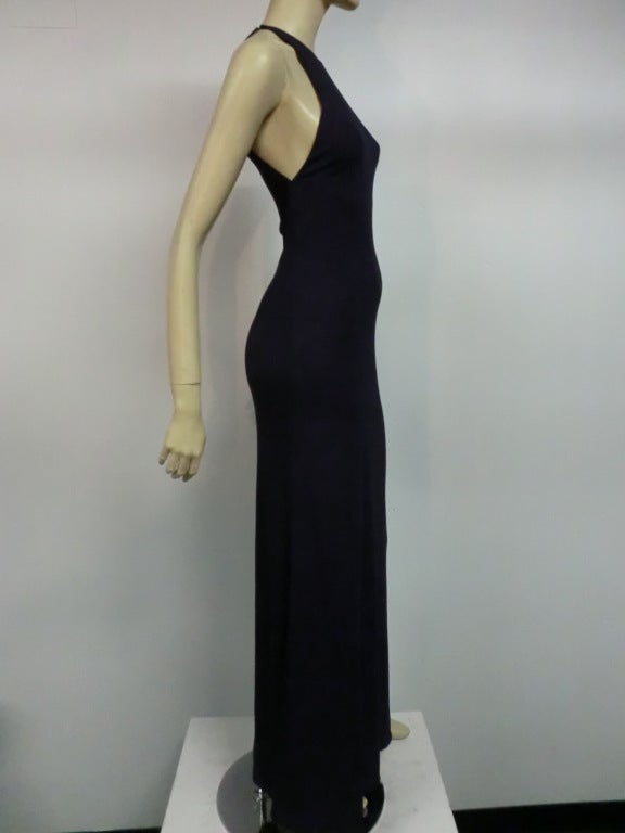A fantastically simple and striking 70s Halston racer top style matte jersey gown in navy blue.  Heavy weight jersey drapes beautifully. Hook closures at shoulders.
