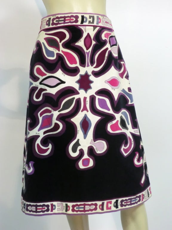 Emilio Pucci 60s cotton velveteen skirt with border print waist and hem in black background with aubergine, fuchsia and pinks.  A-Line shapeOriginally sold at Saks Fifth Avenue.  Size 6
