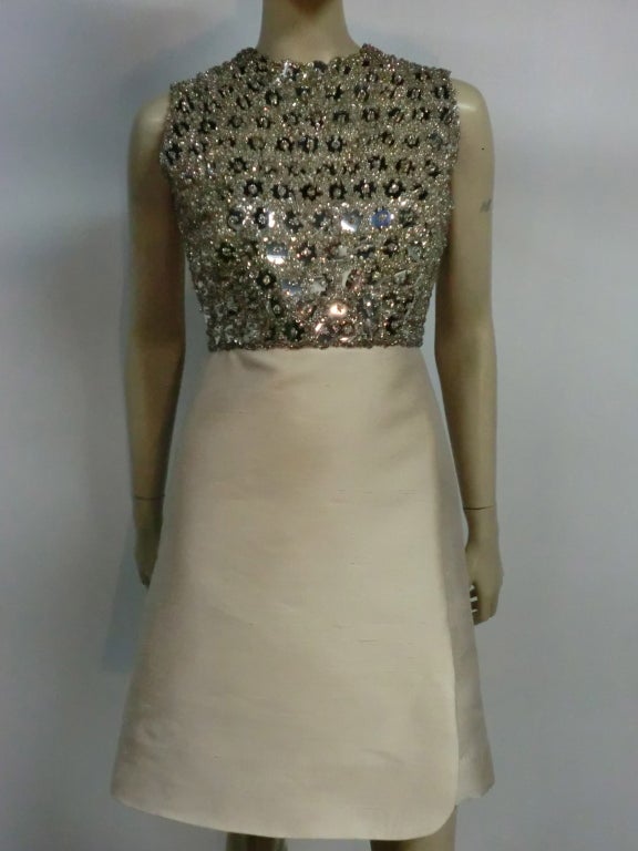 A beautiful 60s ivory shantung silk A-Line dress with molded, fitted capelet and extravagantly beaded and sequined 