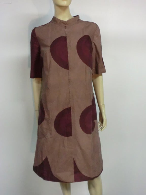 A Marimekko canvas coat dress: zip front with deep side seam pockets, nehru collar and A-line shape.  Size 6-8