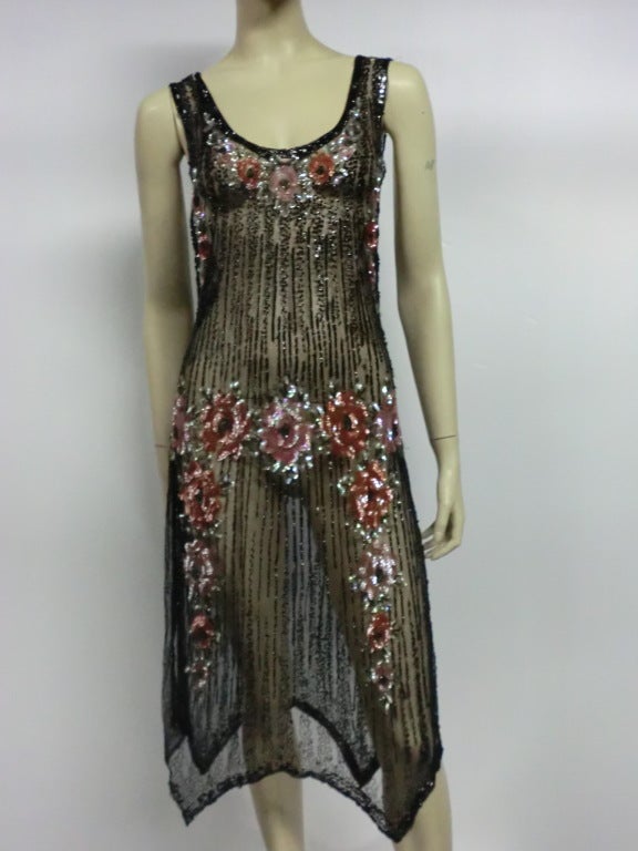 A gorgeous 1920s beaded silk tulle evening dress with handkerchief hem, sequined floral garlands and tank style.  Gorgeous.