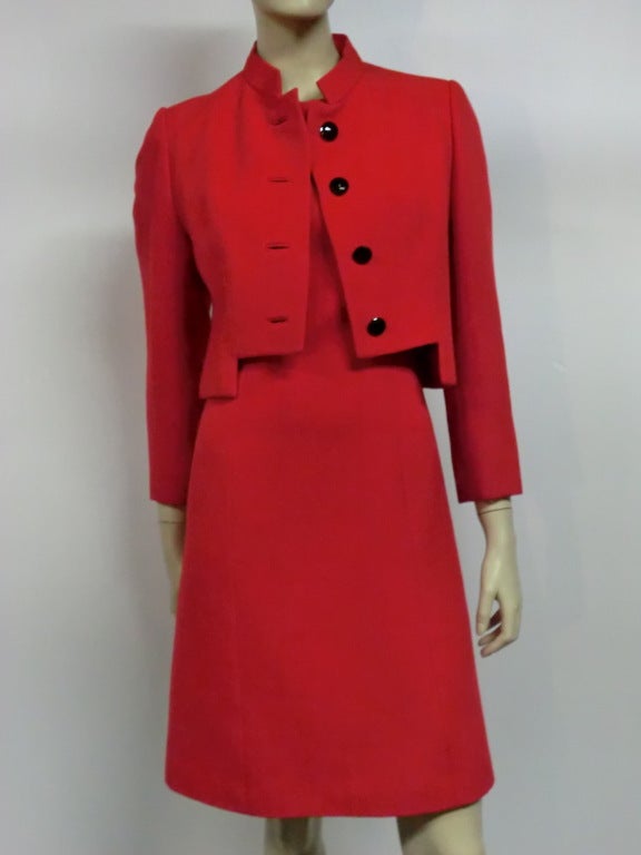 A military inspired Gary Keehn 1960s dress and jacket ensemble of red wool and black faceted glass buttons.  Nehru style collar and notched waist line on jacket.