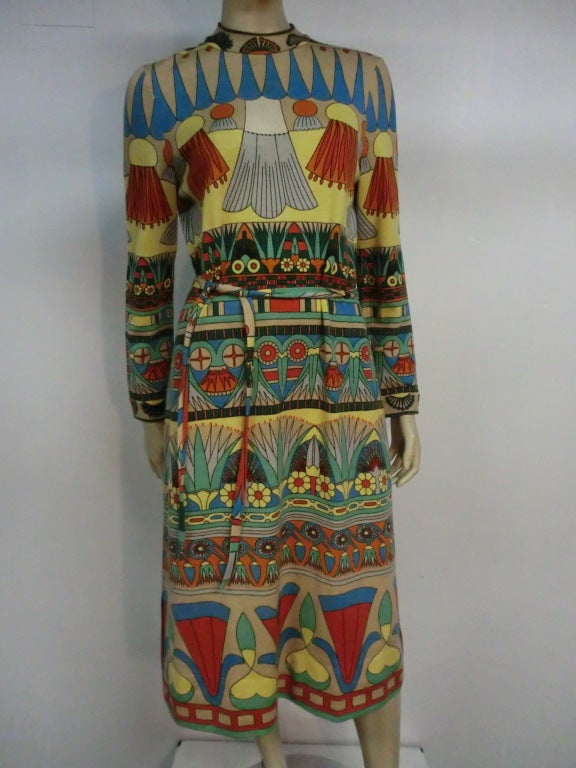 60s Goldworm Egyptian revival print merino wool jersey knit dress with matching belt.  Vintage size 16. Approx. 8 modern sizing