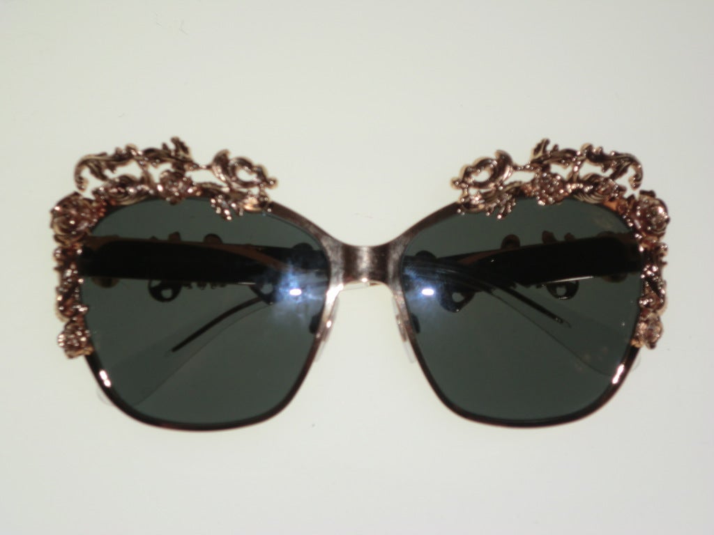 Dolce & Gabbana gold plated 3 dimensional floral embellished aviator style sunglasses.  Mint condition with box and carrying case, never worn.