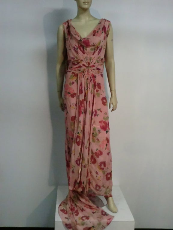 1930s stunning Henri Bendel couture silk chiffon draped bias gown:  completely hand crafted with ring detail at shoulders.  Sleeveless, with a stylized floral print, cowl neck and starburst gathering at center front. Long swag on skirt back.  Long